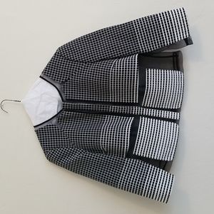 Per Se color block suit, black and white. 69% cotton. 31% polyester.
